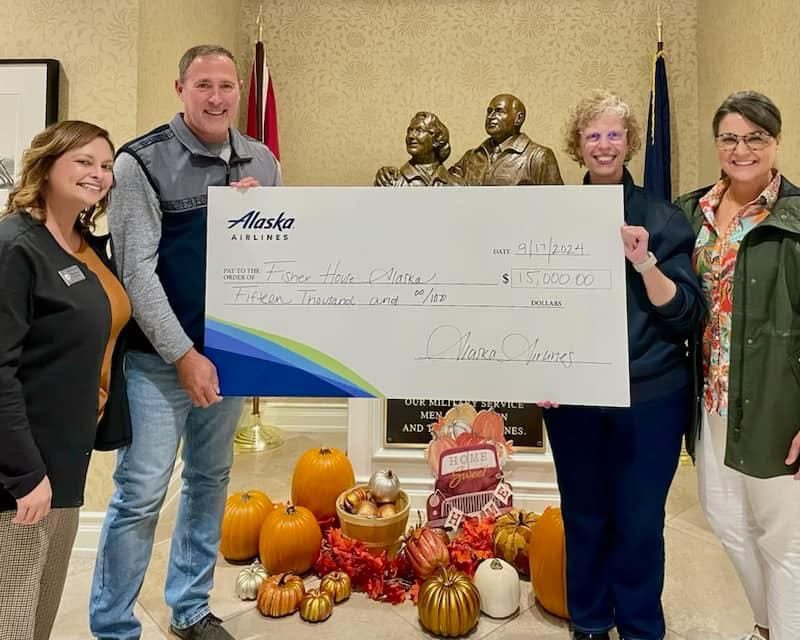 An Alaska Airlines donation presented to Fisher House of Alaska staff and board members