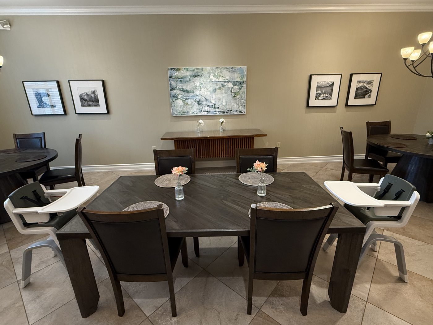 The Fisher House dining room, with family tables, high chairs, and fresh flowers
