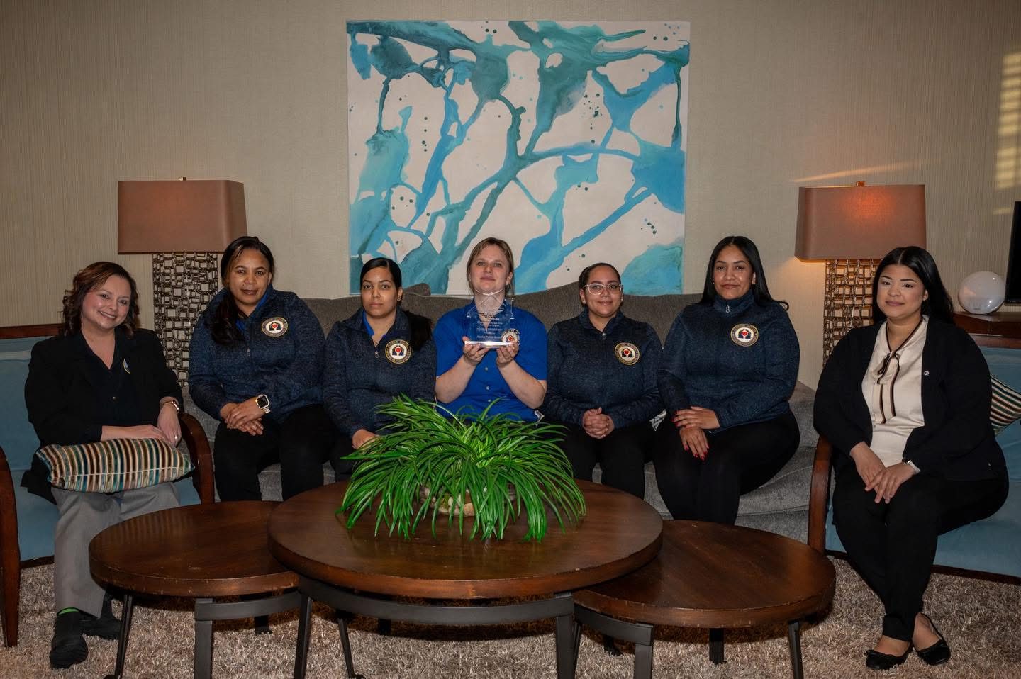 The Alaska Fisher House staff team gathered in the living room